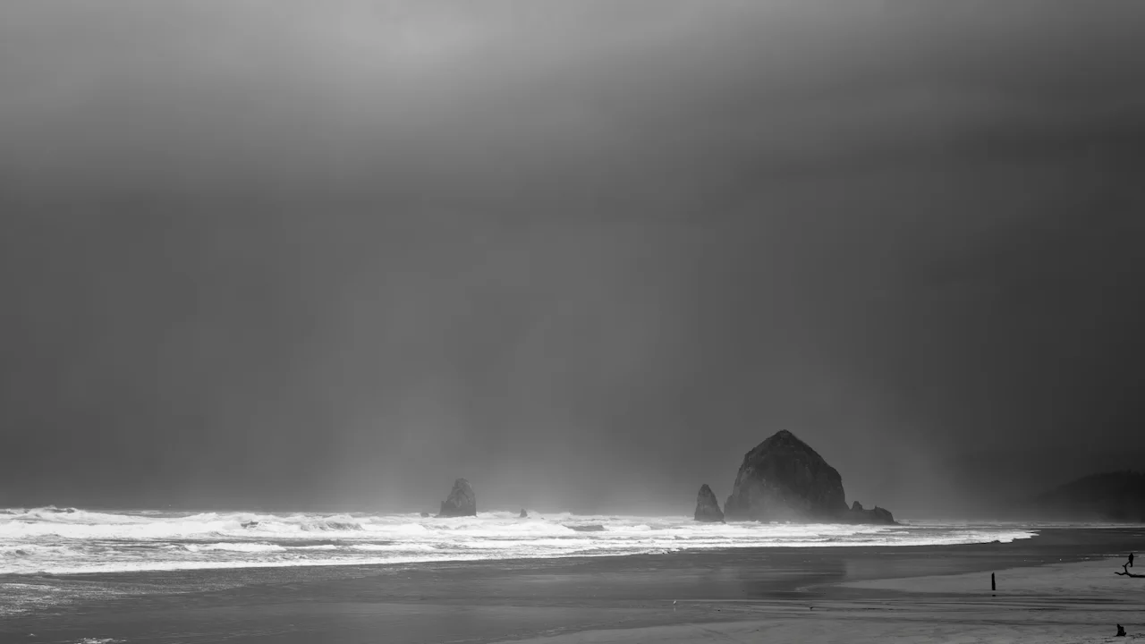 Haystack Rock standing in the surf on the Oregon coast